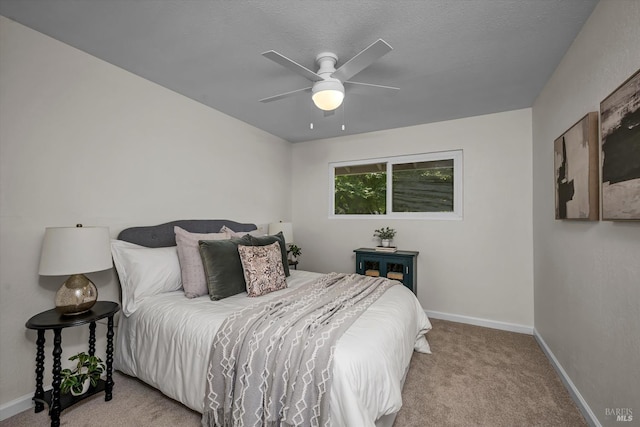 bedroom featuring baseboards, carpet flooring, and ceiling fan