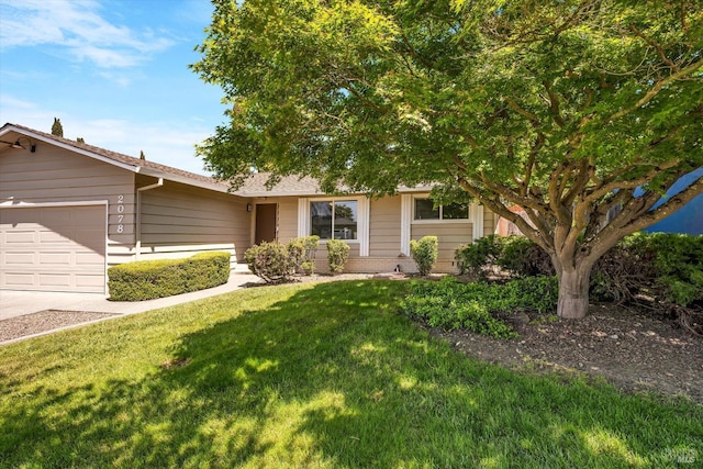 view of front of property with driveway, a front lawn, and a garage