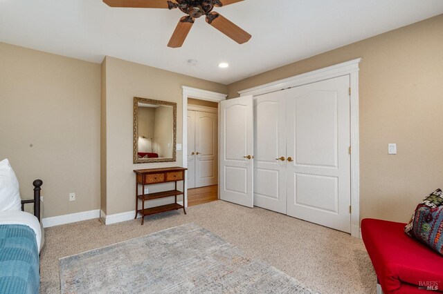 bedroom featuring a closet, baseboards, carpet floors, recessed lighting, and a ceiling fan