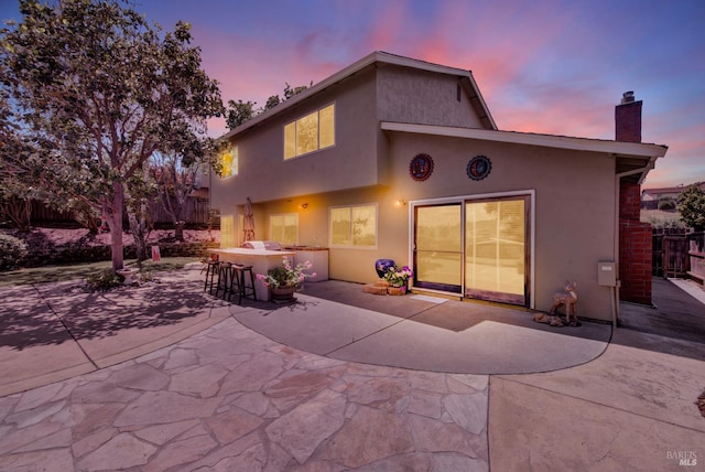 1163 Granada St, Vallejo, CA 94591 - rear view of house featuring a patio area, a chimney, and stucco siding