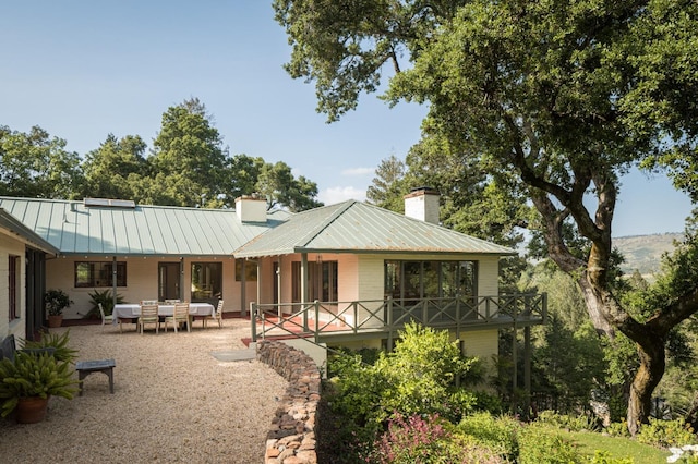 2480 Spring Mountain Rd, Saint Helena, CA 94574 - rear view of property with a chimney, a metal roof, and a patio area