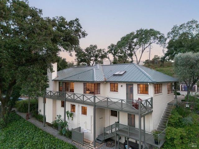 2480 Spring Mountain Rd, Saint Helena, CA 94574 - back of house featuring stairway, a balcony, a metal roof, a standing seam roof, and a chimney