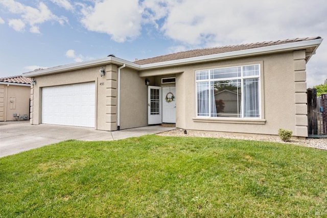 ranch-style house with concrete driveway, a front lawn, an attached garage, and stucco siding