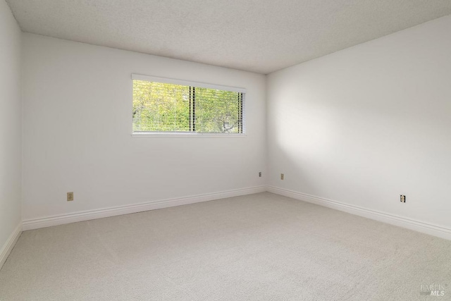 728 Walnut Ct, Novato, CA 94945 - empty room featuring light carpet, baseboards, and a textured ceiling
