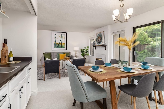 728 Walnut Ct, Novato, CA 94945 - dining area featuring light carpet, a chandelier, and a textured ceiling