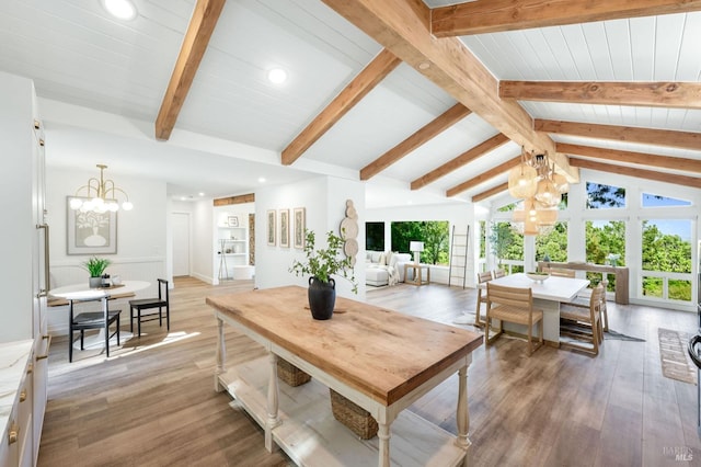 dining area featuring a chandelier, recessed lighting, beam ceiling, and light wood finished floors