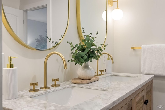 interior details featuring double vanity and a sink