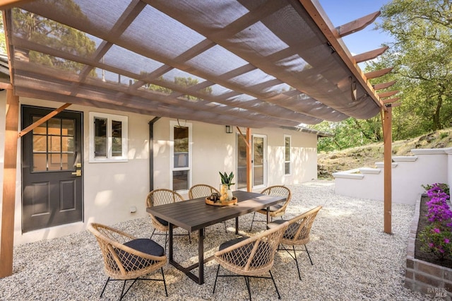 view of patio / terrace featuring outdoor dining area and a pergola