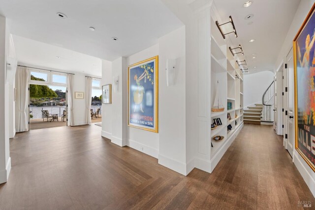 72 Lagoon Rd, Belvedere, CA 94920 - hall with wood finished floors, stairway, and baseboards