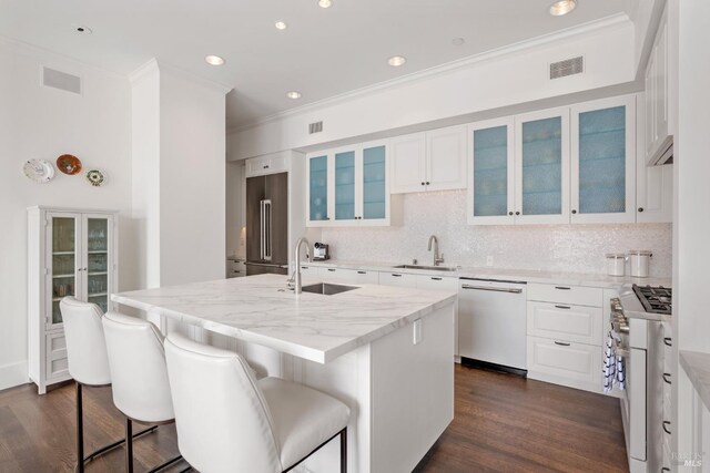 72 Lagoon Rd, Belvedere, CA 94920 - kitchen featuring a sink, premium appliances, ornamental molding, dark wood-style floors, and decorative backsplash