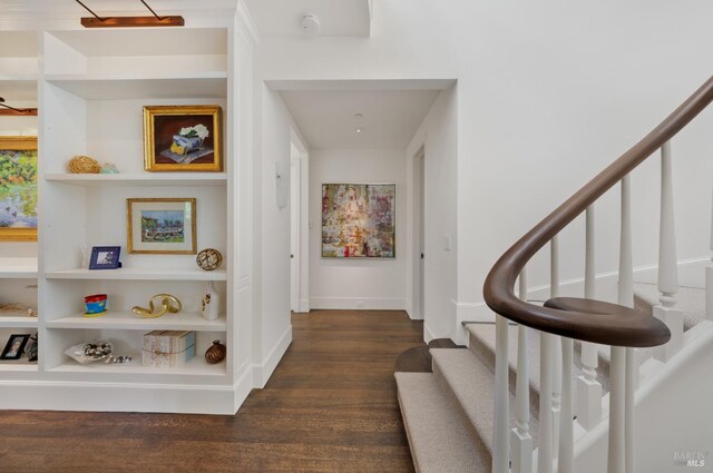 72 Lagoon Rd, Belvedere, CA 94920 - hall featuring stairs, dark wood finished floors, and baseboards