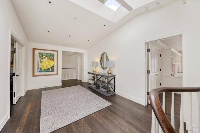 72 Lagoon Rd, Belvedere, CA 94920 - entryway featuring a skylight, vaulted ceiling, dark wood-type flooring, and baseboards