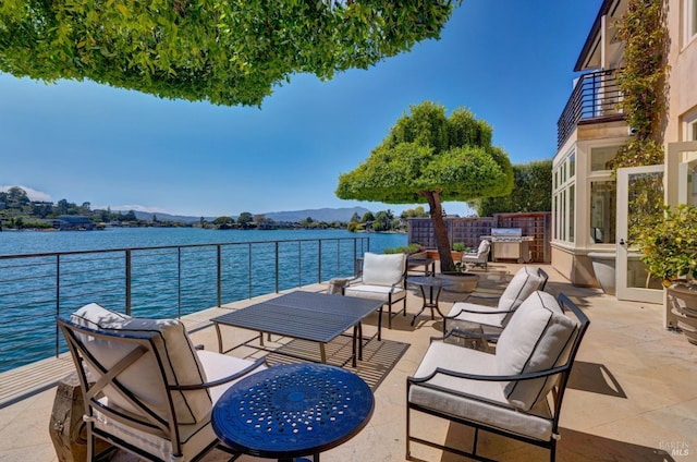 72 Lagoon Rd, Belvedere, CA 94920 - view of patio / terrace with a balcony, exterior kitchen, a water view, and a grill