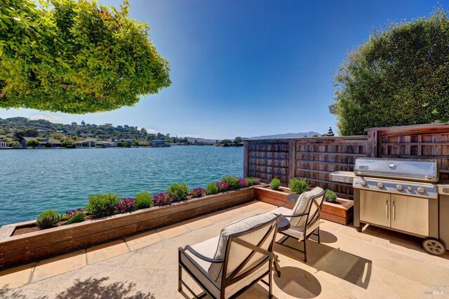 72 Lagoon Rd, Belvedere, CA 94920 - view of patio with a water view, fence, and grilling area