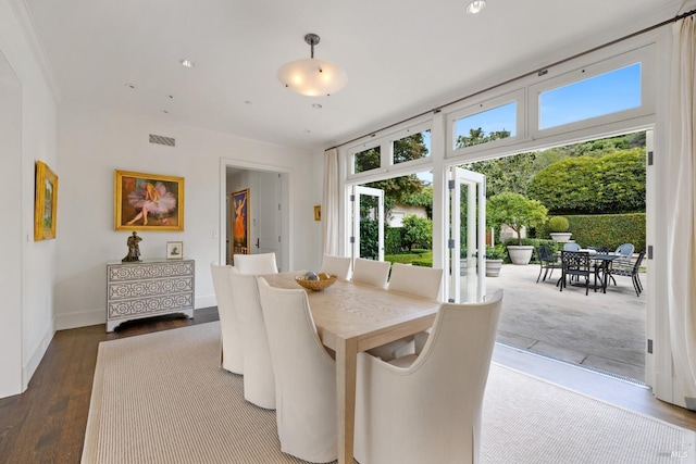 72 Lagoon Rd, Belvedere, CA 94920 - dining room featuring healthy amount of natural light, wood finished floors, and baseboards