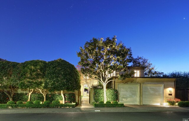 72 Lagoon Rd, Belvedere, CA 94920 - obstructed view of property with stucco siding and a garage