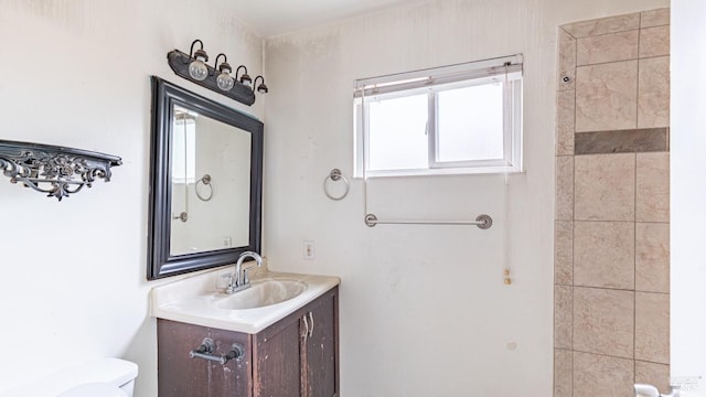 bathroom featuring toilet and vanity