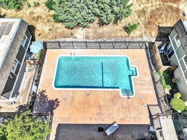 community pool featuring fence