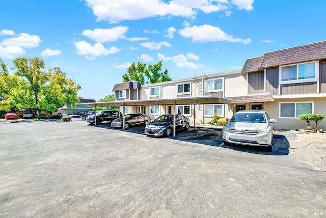 view of partially covered parking lot