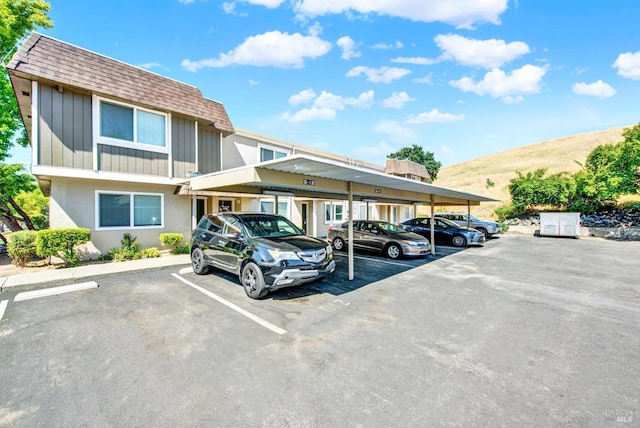 view of partially covered parking lot