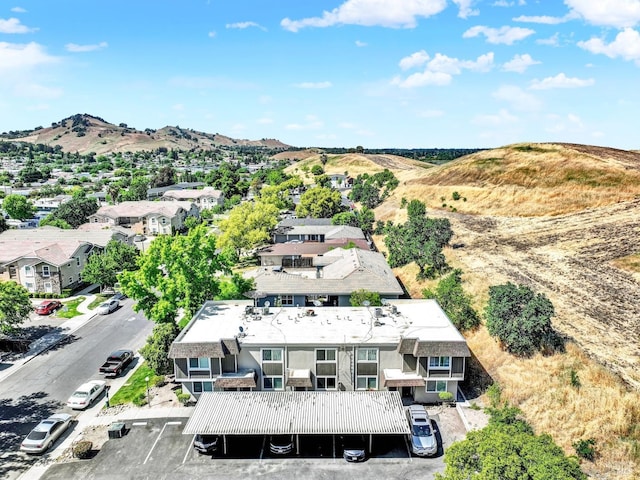 birds eye view of property featuring a mountain view and a residential view