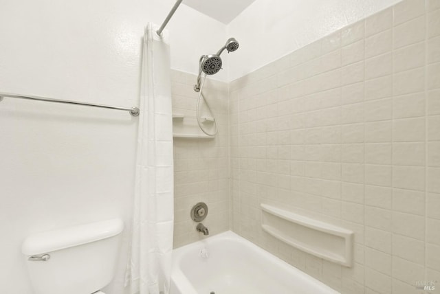 bathroom with shower / bath combo and toilet