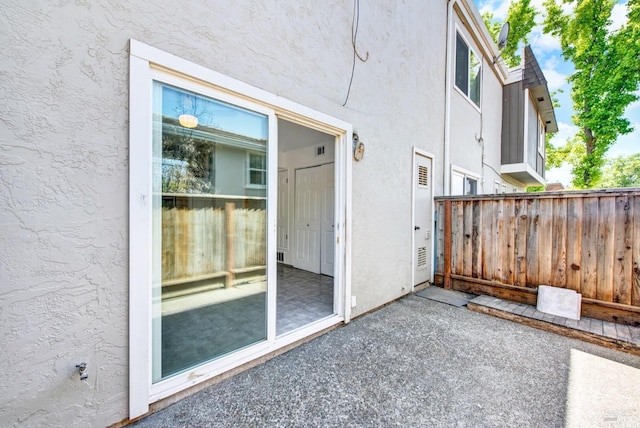 view of patio / terrace featuring fence