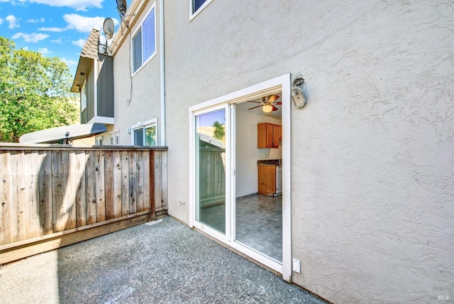 exterior space with a patio and stucco siding
