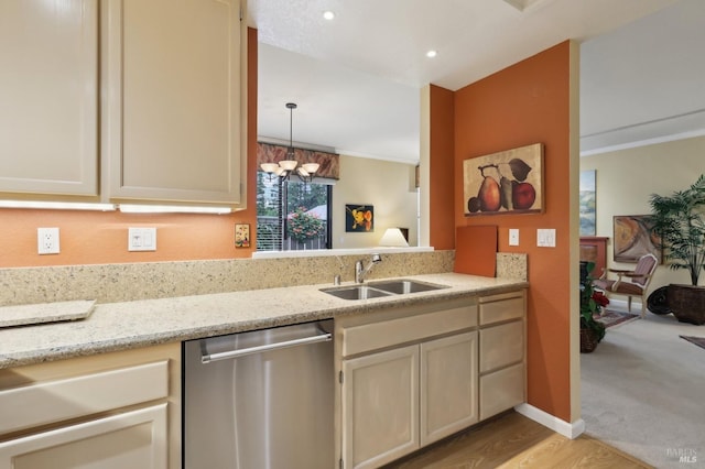 kitchen featuring recessed lighting, stainless steel dishwasher, light stone counters, ornamental molding, and a sink