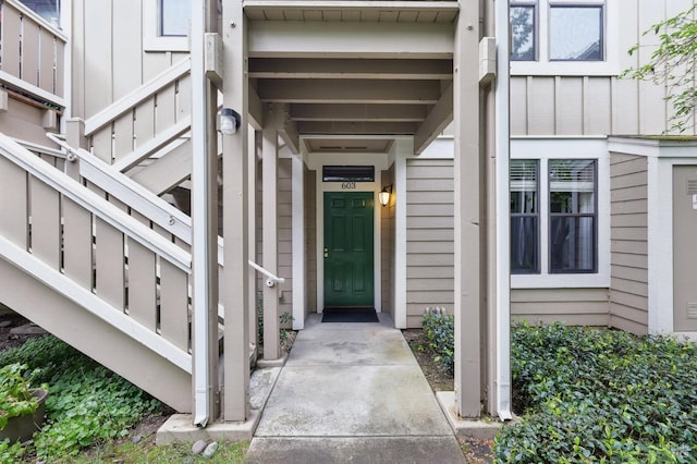 view of exterior entry with board and batten siding