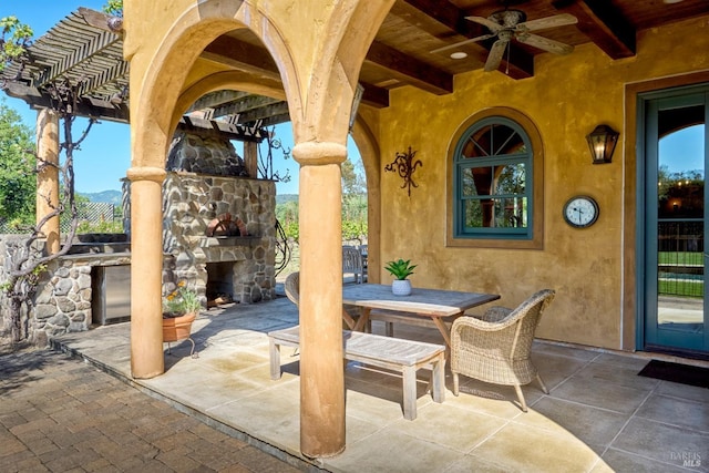 view of patio / terrace with an outdoor stone fireplace, a ceiling fan, a pergola, and outdoor dining area