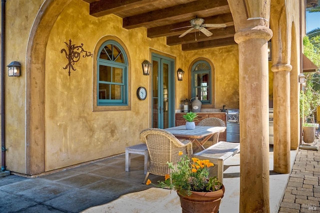 view of patio / terrace featuring ceiling fan