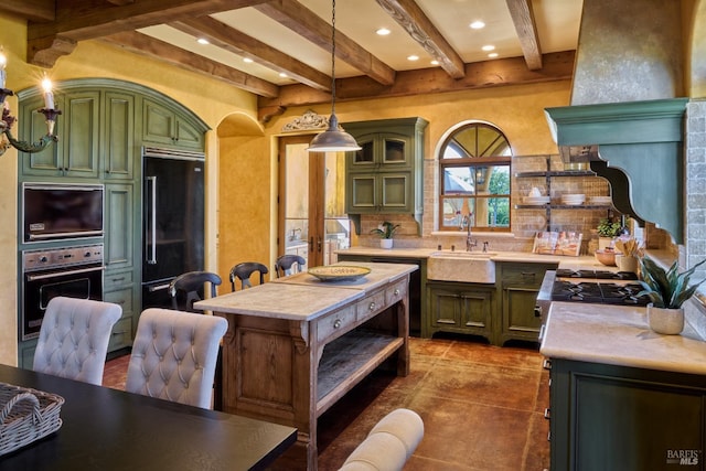 kitchen with open shelves, a sink, light countertops, black appliances, and green cabinets