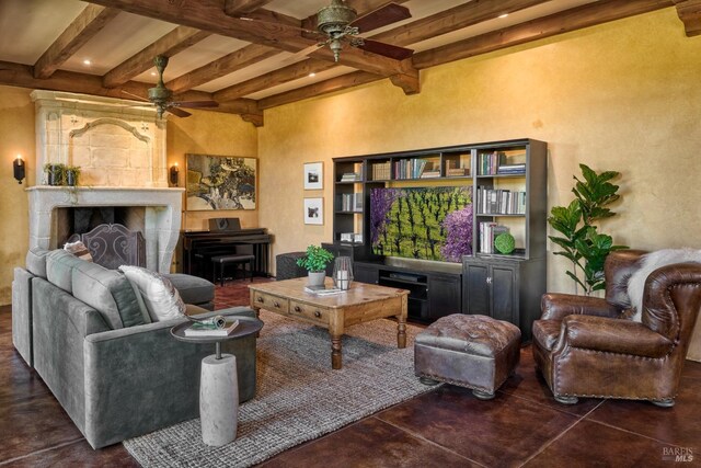 living area featuring a ceiling fan, concrete flooring, and beam ceiling