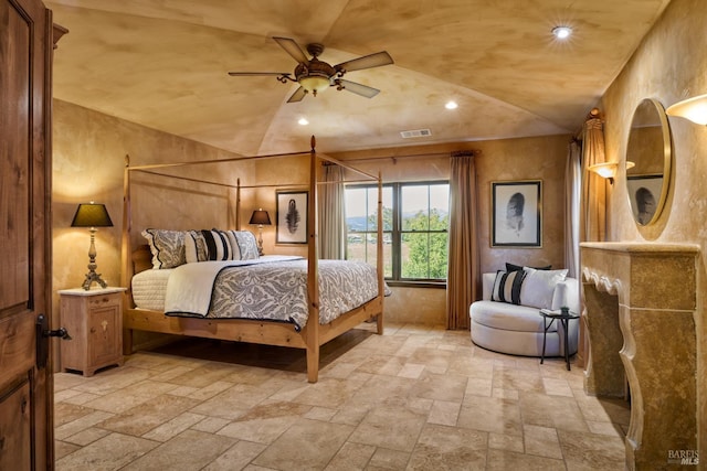 bedroom featuring visible vents, recessed lighting, lofted ceiling, and stone tile flooring