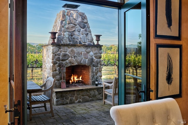 interior space featuring an outdoor stone fireplace