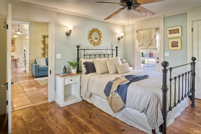 bedroom with wood-type flooring, ornamental molding, a ceiling fan, and access to exterior