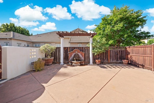 view of patio / terrace with a pergola and fence private yard