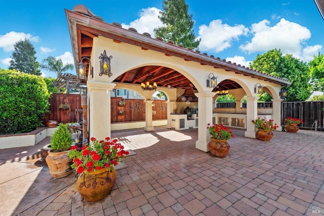 view of patio featuring fence