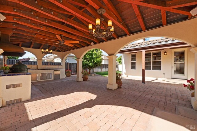 view of patio with ceiling fan, fence, and area for grilling