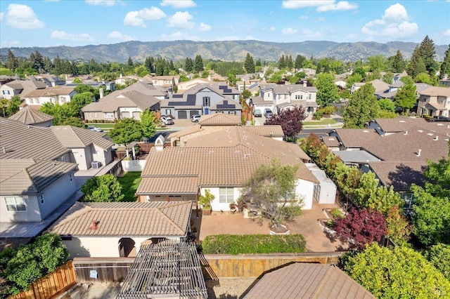 birds eye view of property with a residential view and a mountain view
