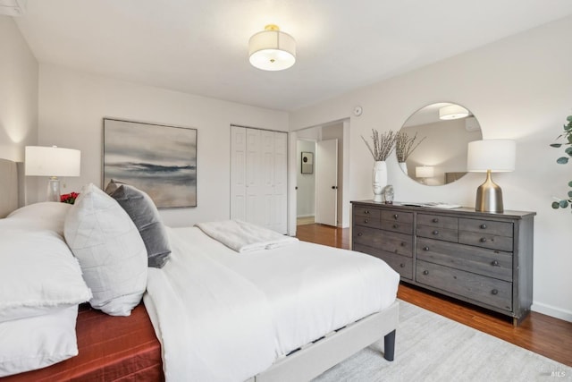 bedroom with a closet and wood finished floors