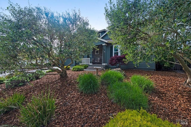 obstructed view of property with a porch