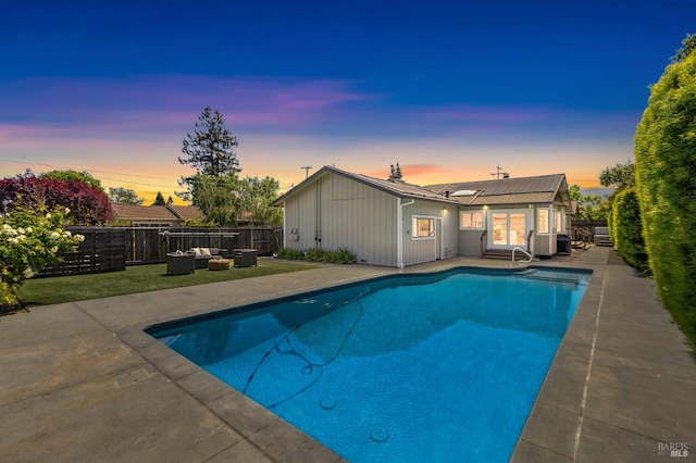 view of pool featuring a patio, an outdoor living space, fence, and a fenced in pool