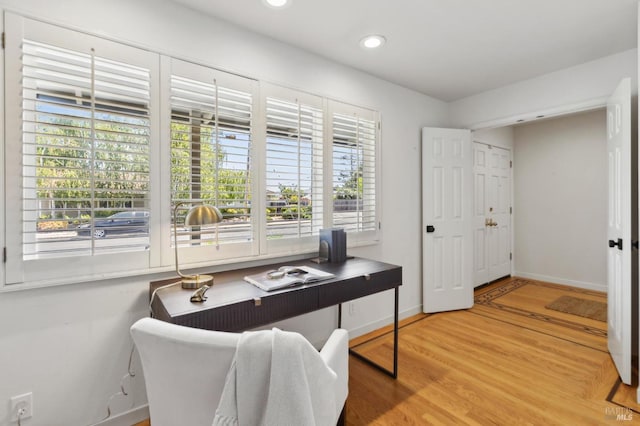 home office with recessed lighting, baseboards, and light wood-style floors