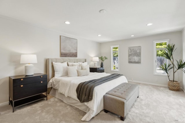 bedroom featuring recessed lighting, baseboards, and light carpet