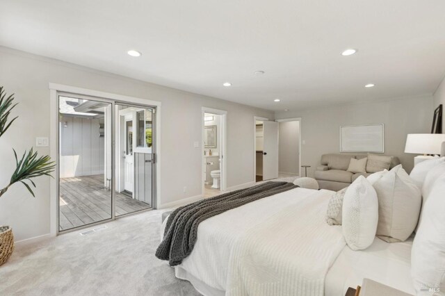 bedroom with access to exterior, baseboards, recessed lighting, light colored carpet, and connected bathroom