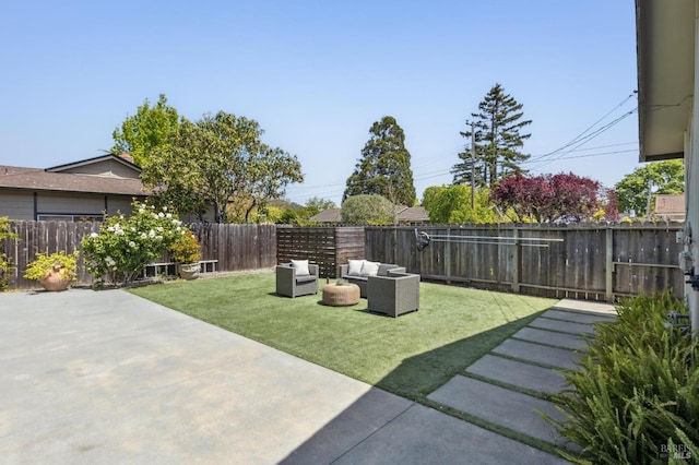 view of yard with a fenced backyard, a patio area, and outdoor lounge area