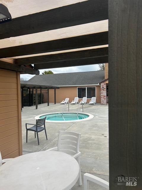 community pool with a patio