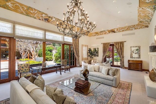 living room with visible vents, recessed lighting, a high ceiling, and a chandelier